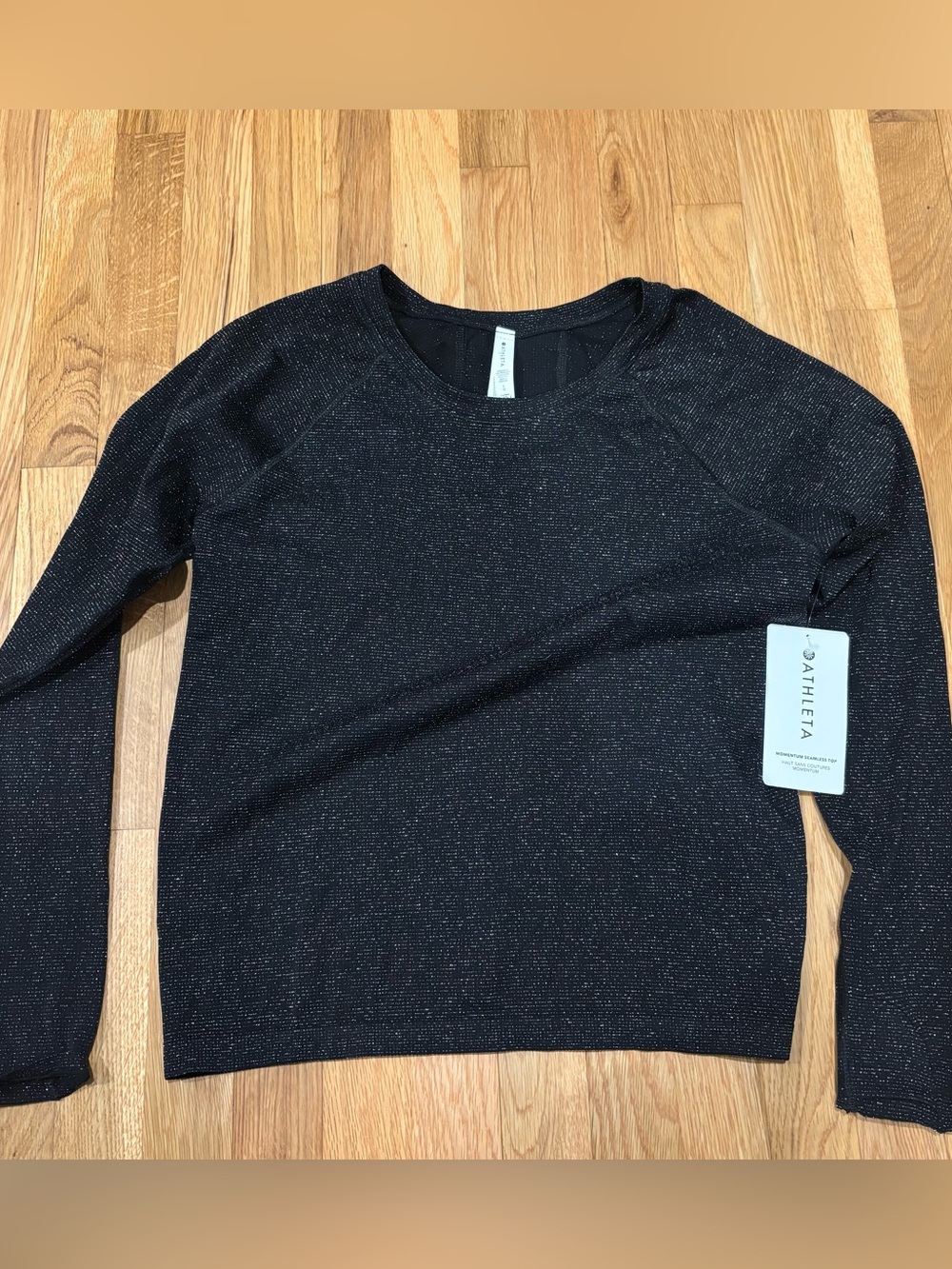 Brand new with tags. Momentum seamless top. Athleta. Black glitter. Size Large